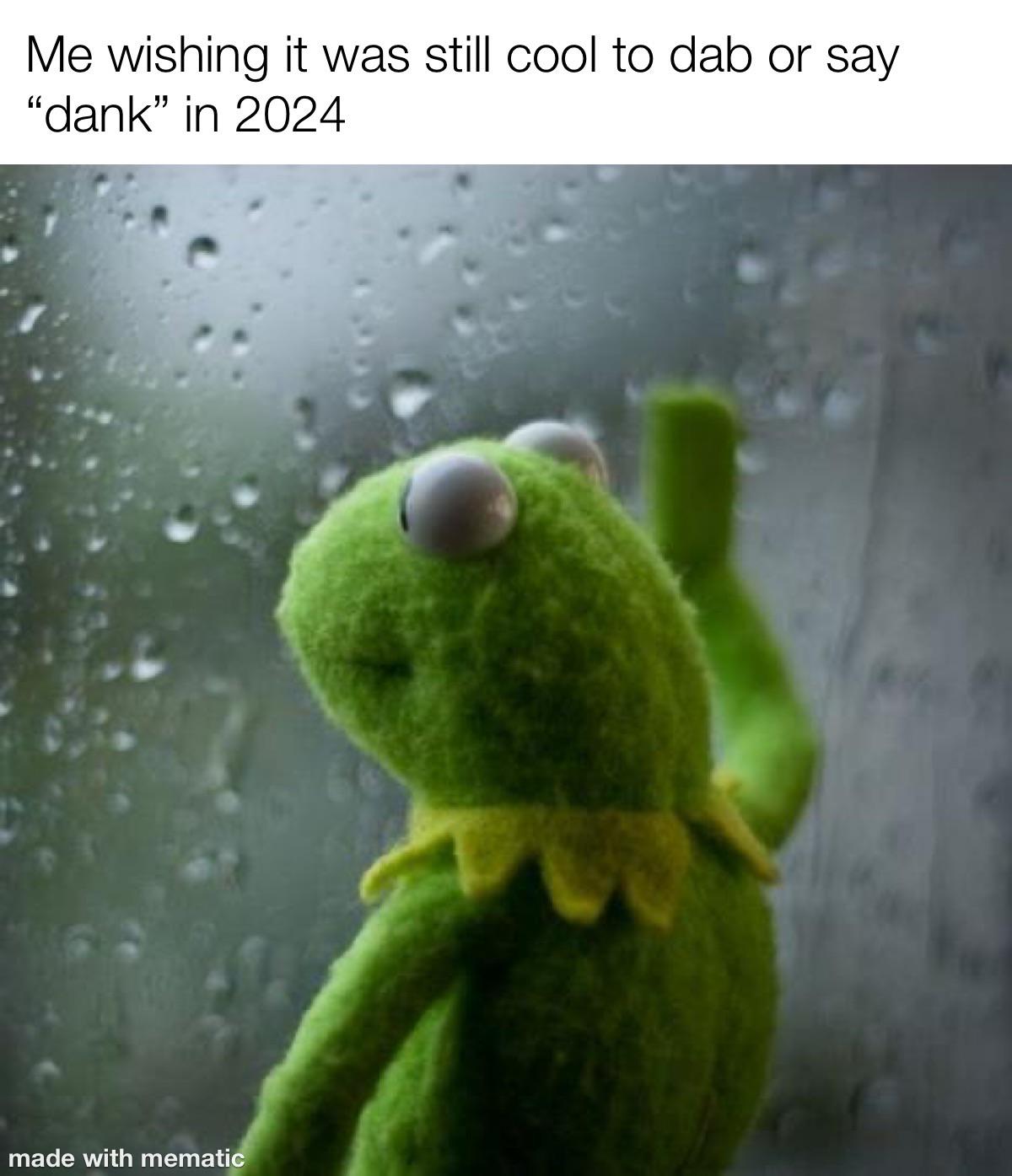 Sad Kermit looking out rainy window