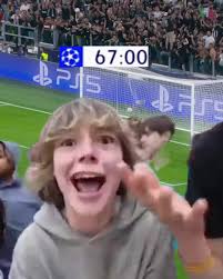 Excited young fan cheering at soccer stadium